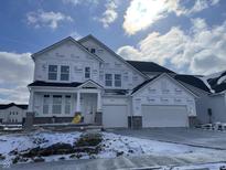 Spacious two-story home featuring a three-car garage and unfinished yard, set against a partially cloudy sky at 4991 Elaine Ct, Noblesville, IN 46062