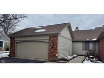 Brick house with attached garage and walkway at 3422 Admiralty Ln, Indianapolis, IN 46240