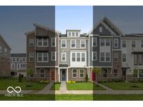 Charming townhomes with colorful doors and well-maintained lawns in a friendly neighborhood setting at 7340 W County Road 600 Rd, McCordsville, IN 46055