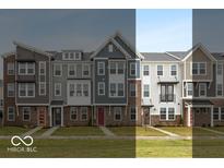 View of several new townhomes, with brick accents and various siding colors at 7348 W County Road 600 Rd # 12-604, McCordsville, IN 46055