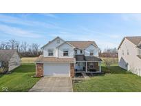 Two-story house with a brick facade, attached garage, and well-maintained lawn at 800 Gondola Run, Greenfield, IN 46140