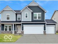 Charming two-story home with a two-car garage and stylish blue and gray siding at 67 Sterling Pl, New Whiteland, IN 46184