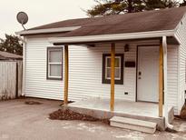 White vinyl sided home with covered porch and small front yard at 2342 Hoyt Ave, Indianapolis, IN 46203