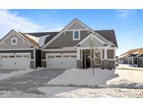 Beautiful home featuring gray siding, a two-car garage, and a well-manicured yard at 16689 Cattle Hollow Ln, Noblesville, IN 46060