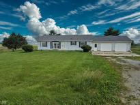 Charming single-story home with an attached two-car garage and well-maintained front yard at 4726 E 210 N, Lebanon, IN 46052