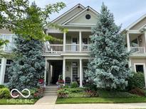 Two-story home with front porch and landscaped yard at 659 Ellsworth St, Indianapolis, IN 46202