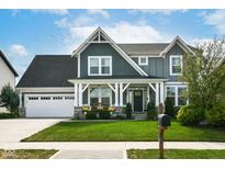 Charming two-story home featuring a well-manicured lawn and inviting front porch at 6431 W Clearview Dr, McCordsville, IN 46055