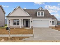 Charming home featuring a two-car garage, inviting front porch, and craftsman-style architecture at 10109 Redwood Peak Ln, Indianapolis, IN 46259