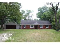 Brick ranch home with attached garage and spacious yard at 231 S Routiers Ave, Indianapolis, IN 46219