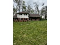 Charming two-story home with brick and siding exterior and a lush green front yard at 454 Tulip Dr, Mooresville, IN 46158