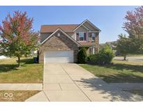 Two-story brick home with attached garage and landscaped lawn at 5701 Brookstone Dr, Indianapolis, IN 46234