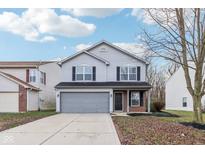 Two-story house with gray siding, brick accents, and a two-car garage at 1127 Maple Stream Dr, Indianapolis, IN 46217