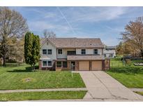 Charming two-story home with a well-maintained lawn and a two-car garage, perfect for Gathering living at 7906 Hampton Pl, Fishers, IN 46038