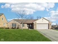 Brick ranch home with attached garage and landscaped lawn at 12334 Buckley Blvd, Cumberland, IN 46229