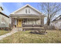 Charming bungalow with brick detailing and a welcoming front porch at 3945 N College Ave, Indianapolis, IN 46205