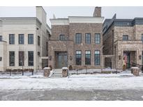Brick front exterior of charming home with snowy landscape at 467 Rayle Dr, Carmel, IN 46032