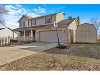 Two-story house with attached garage and basketball hoop at 3 Lakewood Dr, Trafalgar, IN 46181