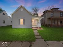 Charming home with a well-maintained lawn, inviting porch and stone walkway, great for curb appeal at 619 Fair Ave, Shelbyville, IN 46176
