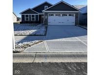 Two-story house with a white garage door and gray siding at 2741 Green Valley Dr, Lebanon, IN 46052