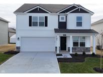 Charming two-story home with a two-car garage, stylish black accents, and manicured lawn at 2989 W Bargello Ln, Monrovia, IN 46157
