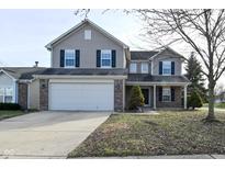Two-story house with attached garage and landscaping at 11369 Pegasus Dr, Noblesville, IN 46060