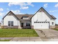 New construction home featuring white siding, a two-car garage, and a well manicured front lawn at 4068 Berry Chase Blvd, Greenwood, IN 46143
