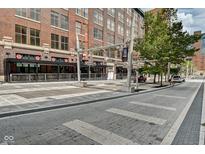 Brick building exterior with a plaza and street view at 141 S Meridian St # 605, Indianapolis, IN 46225