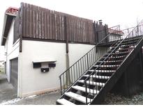 Rear view showing private stairway, garage, and fenced yard at 8360 Paso Del Norte Ct, Indianapolis, IN 46227