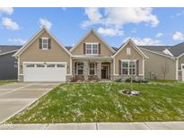 Two-story home with neutral siding, a white garage door, and a well-manicured lawn at 1271 Clairet Dr, Westfield, IN 46074