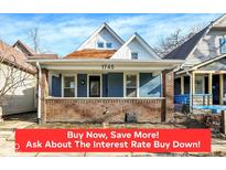 Charming home featuring a brick foundation, inviting front porch, and classic architectural details at 1745 S Talbott St, Indianapolis, IN 46225