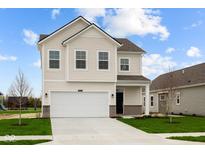 Two-story home with a white exterior, attached garage, and well-maintained lawn under a cloudy blue sky at 1845 James Pierce Dr, Shelbyville, IN 46176