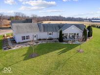 Aerial view of a ranch-style home on a spacious lot with mature trees at 5225 E 1200 N, Morristown, IN 46161