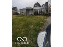 Ranch style home with stone facade and spacious lawn at 5414 E 11Th St, Indianapolis, IN 46219