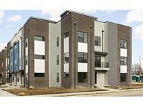 Modern three-story townhome with brick and siding exterior at 1302 English Ave, Indianapolis, IN 46203