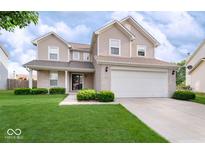 Two-story house with brick and siding, a large yard, and a two-car garage at 15317 Black Gold Ct, Noblesville, IN 46060