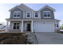Two-story house with gray siding, white garage door, and stone accents at 16775 Cheddar Dr, Noblesville, IN 46060