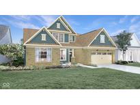 Two-story craftsman style home with neutral siding and landscaping at 19381 Sumrall Pl, Westfield, IN 46074