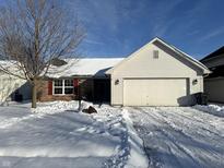 Ranch home with white siding, brick accents, and a snow-covered yard at 837 Trotter Ct, Greenwood, IN 46143