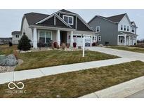 Two-story home with gray siding, landscaping, and a two-car garage at 4175 Bozeman Way, Bargersville, IN 46106