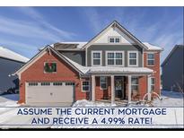 Two-story brick home with gray siding, snow covered front yard, and attached garage at 4223 Mardale Ln, Bargersville, IN 46106