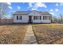 Charming single-story home with a well-maintained front yard and inviting walkway at 6471 Homestead Dr, Indianapolis, IN 46227