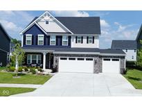Beautiful two-story home with a two-car garage and manicured lawn at 19243 Foley Dr, Westfield, IN 46074