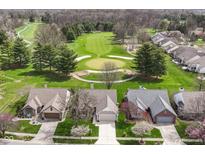 Stunning aerial view of homes overlooking a lush green golf course at 4842 Ashbrook Dr, Noblesville, IN 46062