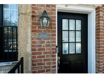 Close-up of a stylish front door, showcasing its design and the building's address number at 6595 Reserve Dr, Indianapolis, IN 46220