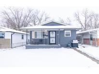 Gray house with snow covered lawn at 1704 Nelson Ave, Indianapolis, IN 46203