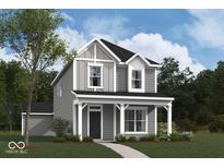 Two-story house with gray siding, white trim, and a front porch at 1705 Real St, Indianapolis, IN 46240