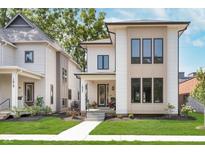 Beautiful modern home with eye-catching design, manicured lawn and inviting front porch at 1822 Central Ave, Indianapolis, IN 46202