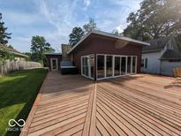 Large backyard deck with hot tub, perfect for entertaining at 2894 W Grove Dr, Greenfield, IN 46140