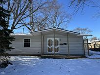 Ranch home with covered porch and detached garage at 3178 Normandy Rd, Indianapolis, IN 46222