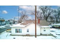 Rear view of house, snow covered yard at 1363 & 1367 S Belmont Ave, Indianapolis, IN 46221